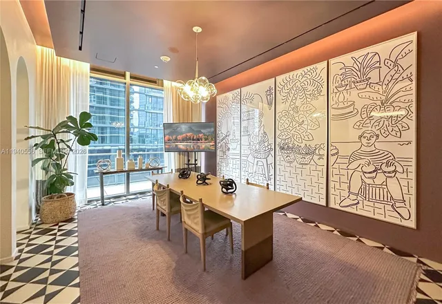 a room with furniture and a potted plant