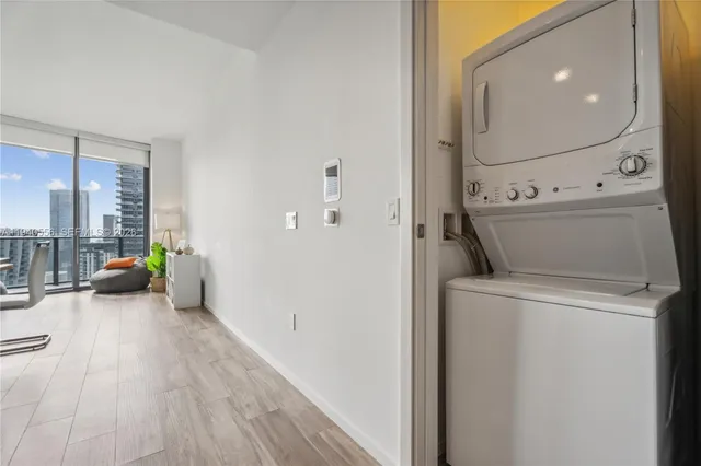 a view of hallway with washer and dryer