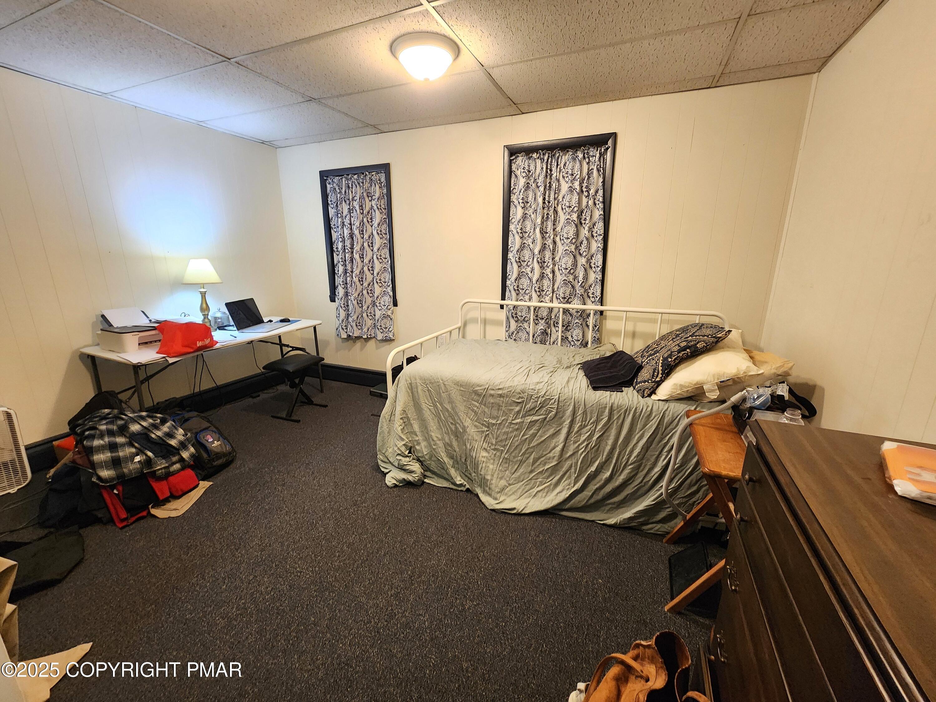 514 North Street Jim Thorpe, PA 18229 - Photo 12 of 34 a bedroom with bed and a couch