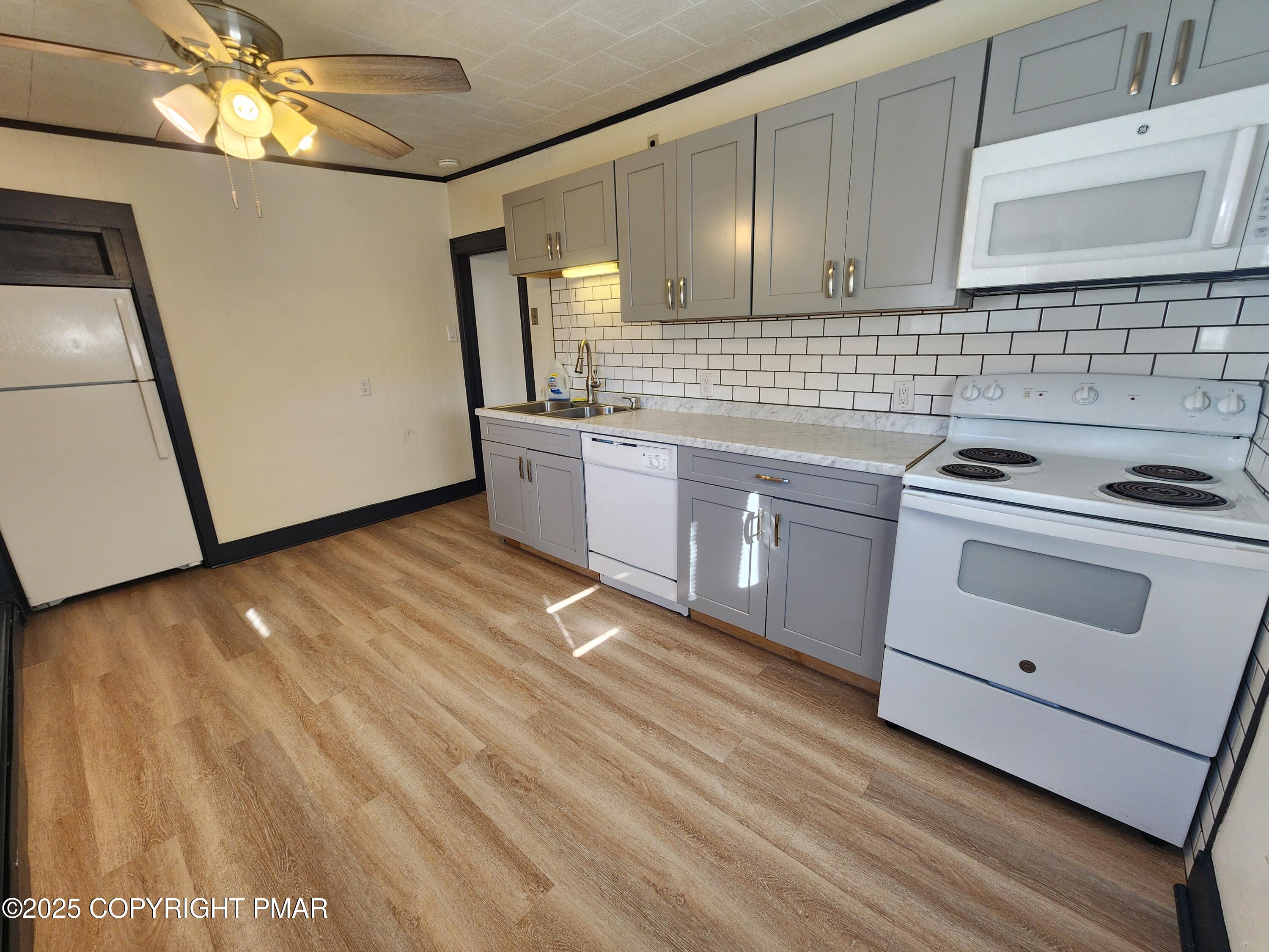 514 North Street Jim Thorpe, PA 18229 - Photo 17 of 34 a kitchen with cabinets a sink and appliances