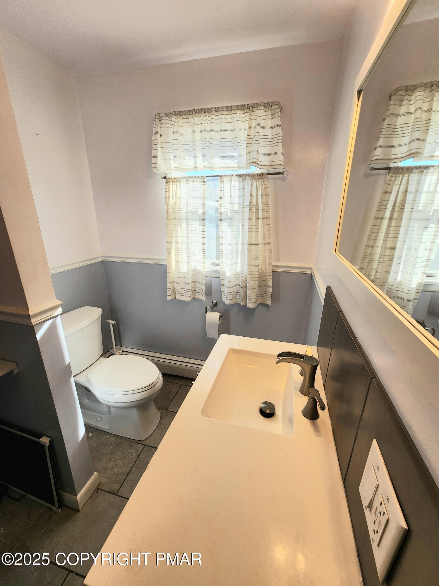 514 North Street Jim Thorpe, PA 18229 - Photo 23 of 34 a bathroom with a sink a toilet and a window