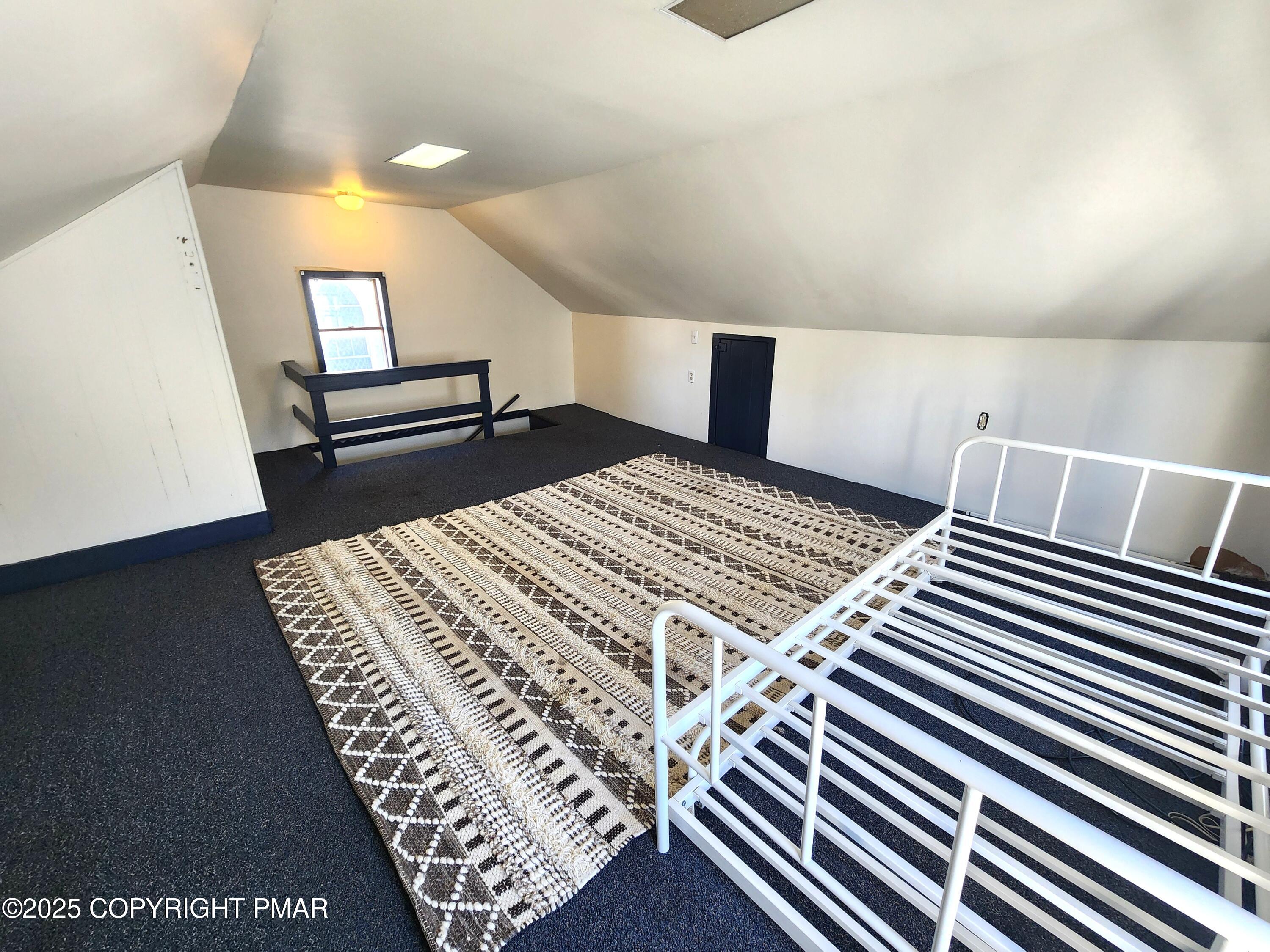 514 North Street Jim Thorpe, PA 18229 - Photo 27 of 34 a bedroom with a bed and wooden floor