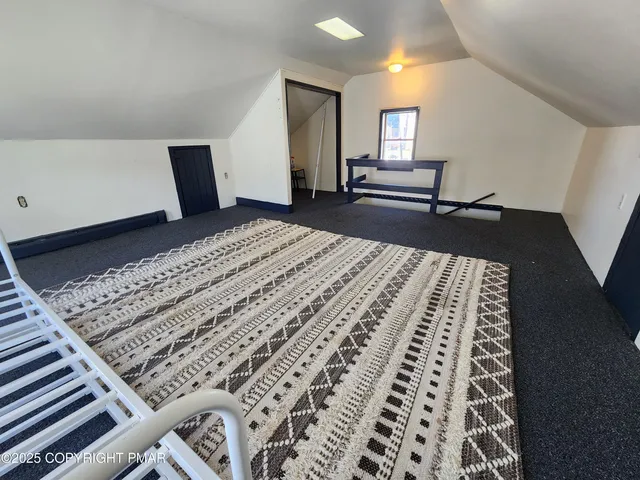 a view of a living room and bathroom