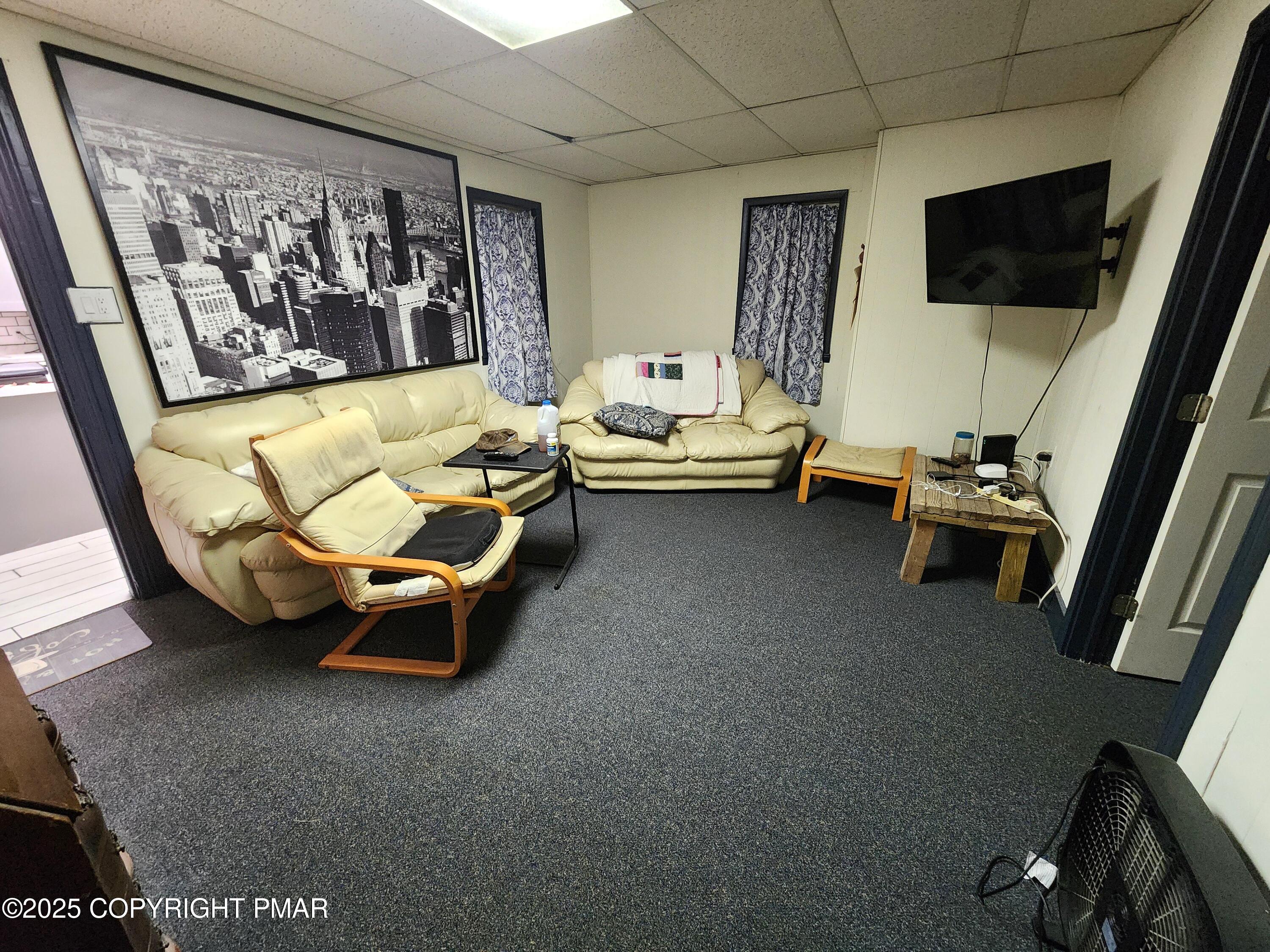 514 North Street Jim Thorpe, PA 18229 - Photo 4 of 34 a living room with furniture and a flat screen tv