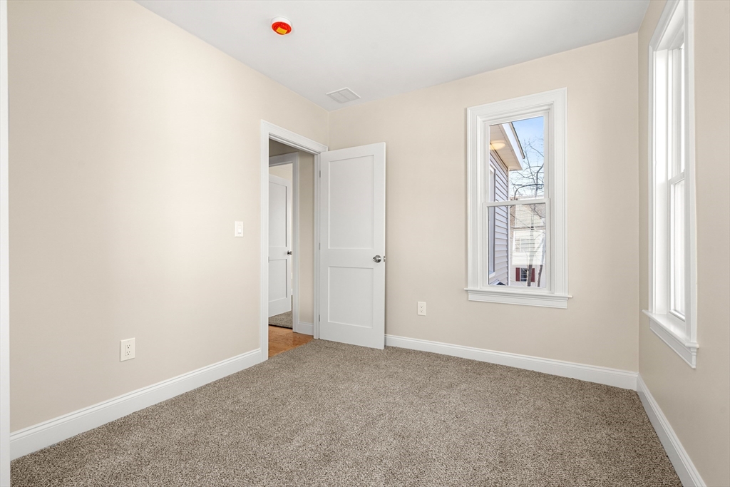 13 River Street, Unit 1 Danvers, MA 01923 - Photo 16 of 23 an empty room with windows