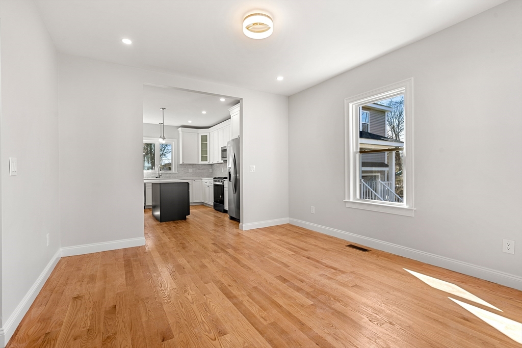 13 River Street, Unit 1 Danvers, MA 01923 - Photo 9 of 23 a view of a kitchen with a sink and a stove top oven