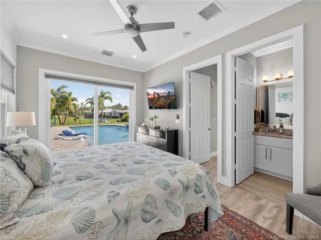 a bedroom with a large bed and a large window