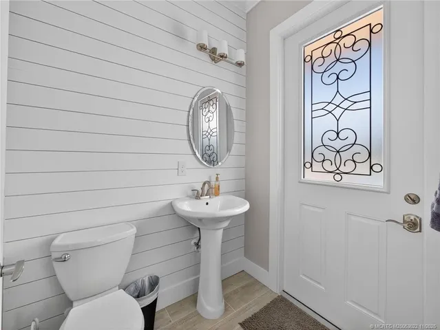 a bathroom with a toilet and a sink