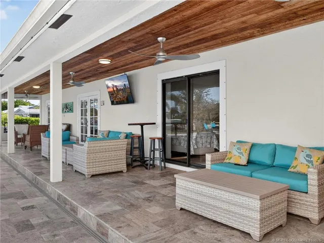 a view of a two chairs in the room and balcony