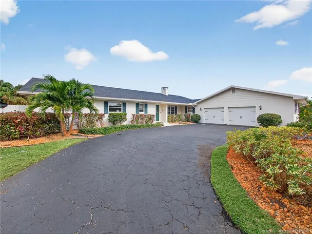 a view of house with yard and entertaining space