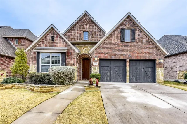 a front view of a house with yard