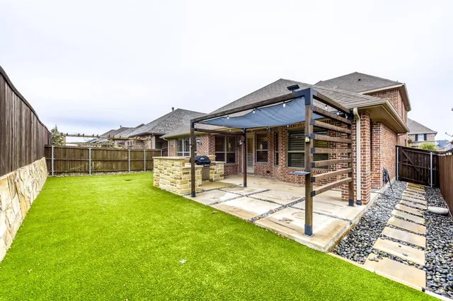 a view of house with backyard porch and patio