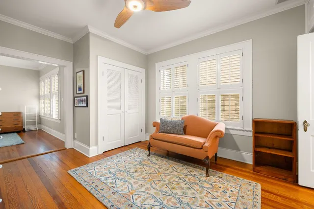 a living room with furniture and a rug