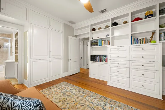 a bedroom with a bed and a cabinets