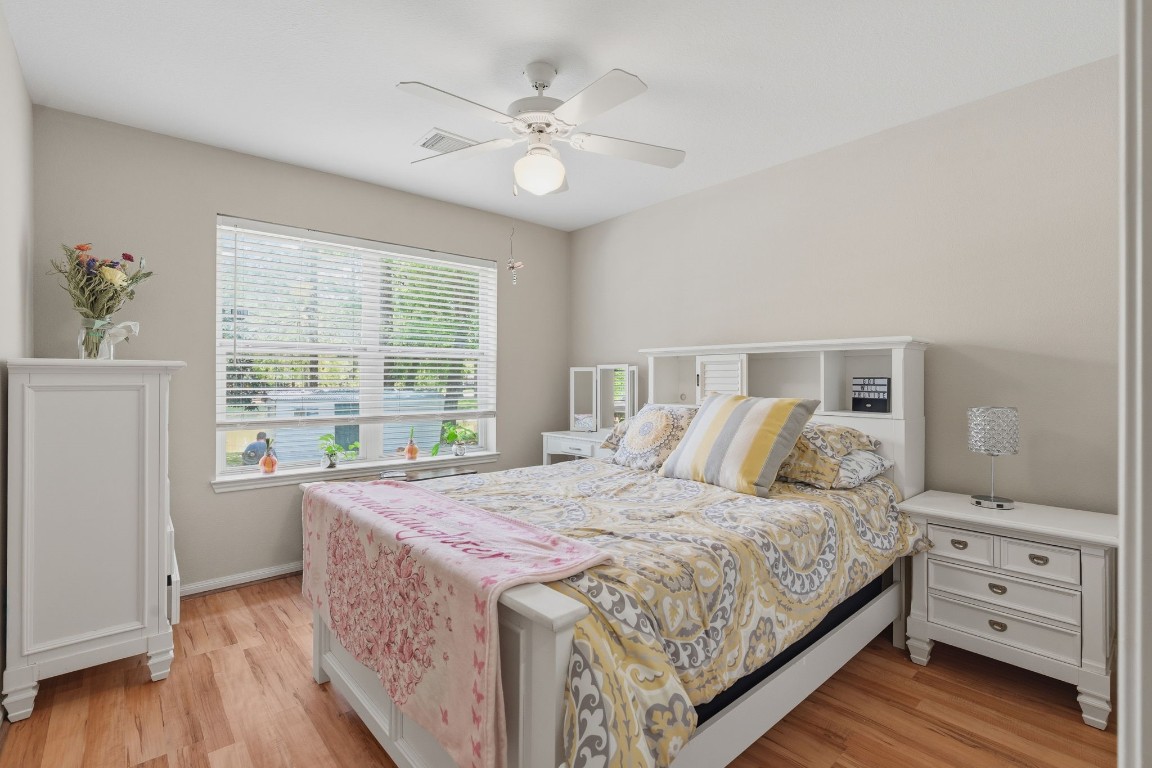 907 Columbia River Road Montgomery, TX 77316 - Photo 14 of 34 a bedroom with a large bed and a window