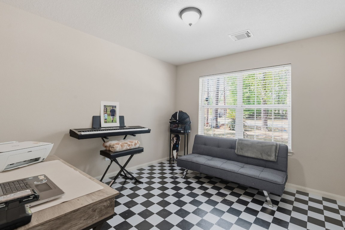 907 Columbia River Road Montgomery, TX 77316 - Photo 15 of 34 a room with furniture a rug and a window