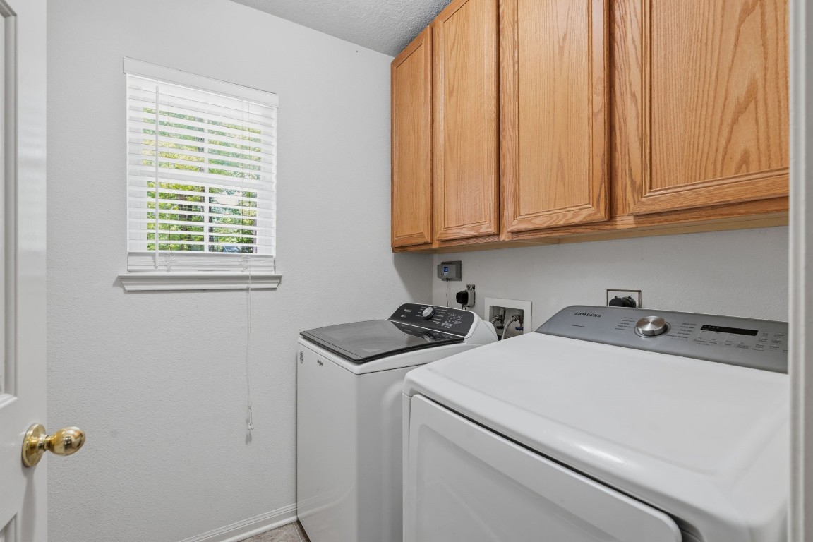 907 Columbia River Road Montgomery, TX 77316 - Photo 16 of 34 a view of storage and utility room with washer and dryer