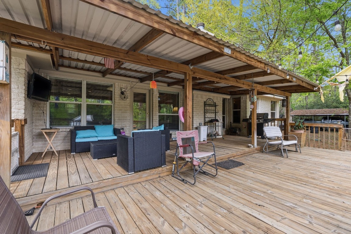 907 Columbia River Road Montgomery, TX 77316 - Photo 18 of 34 a view of a dinning table and chairs in patio of the house