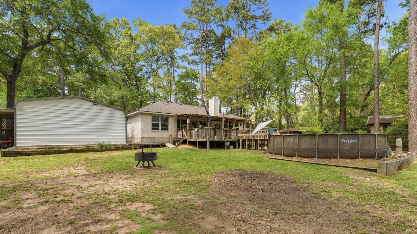 907 Columbia River Road Montgomery, TX 77316 - Photo 22 of 34 a backyard of a house with yard and outdoor seating