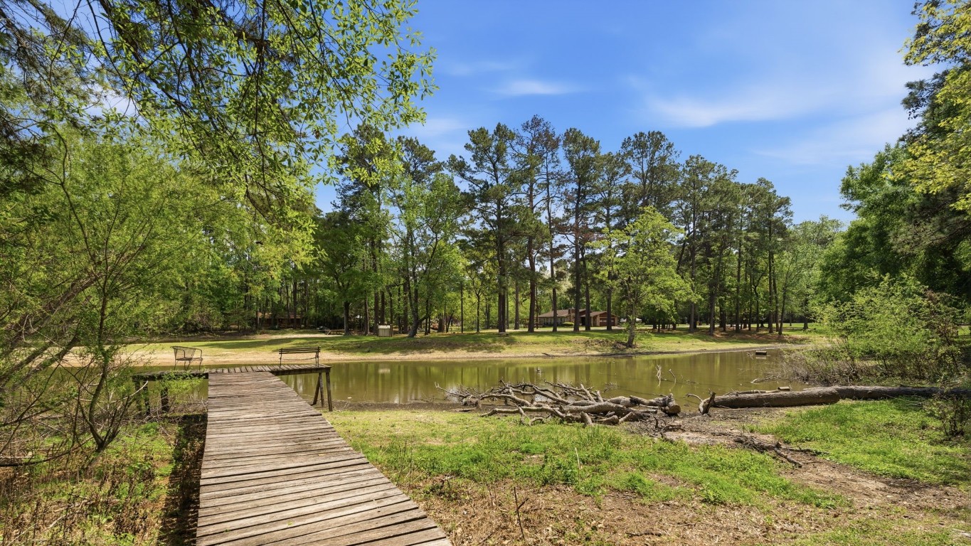 907 Columbia River Road Montgomery, TX 77316 - Photo 25 of 34 a view of a lake with houses in the back