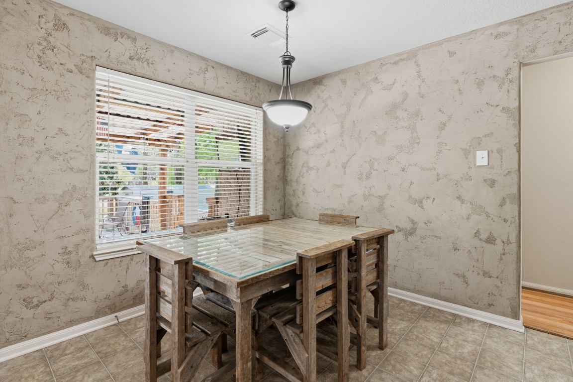 907 Columbia River Road Montgomery, TX 77316 - Photo 3 of 34 a view of a dining room with a table and chairs