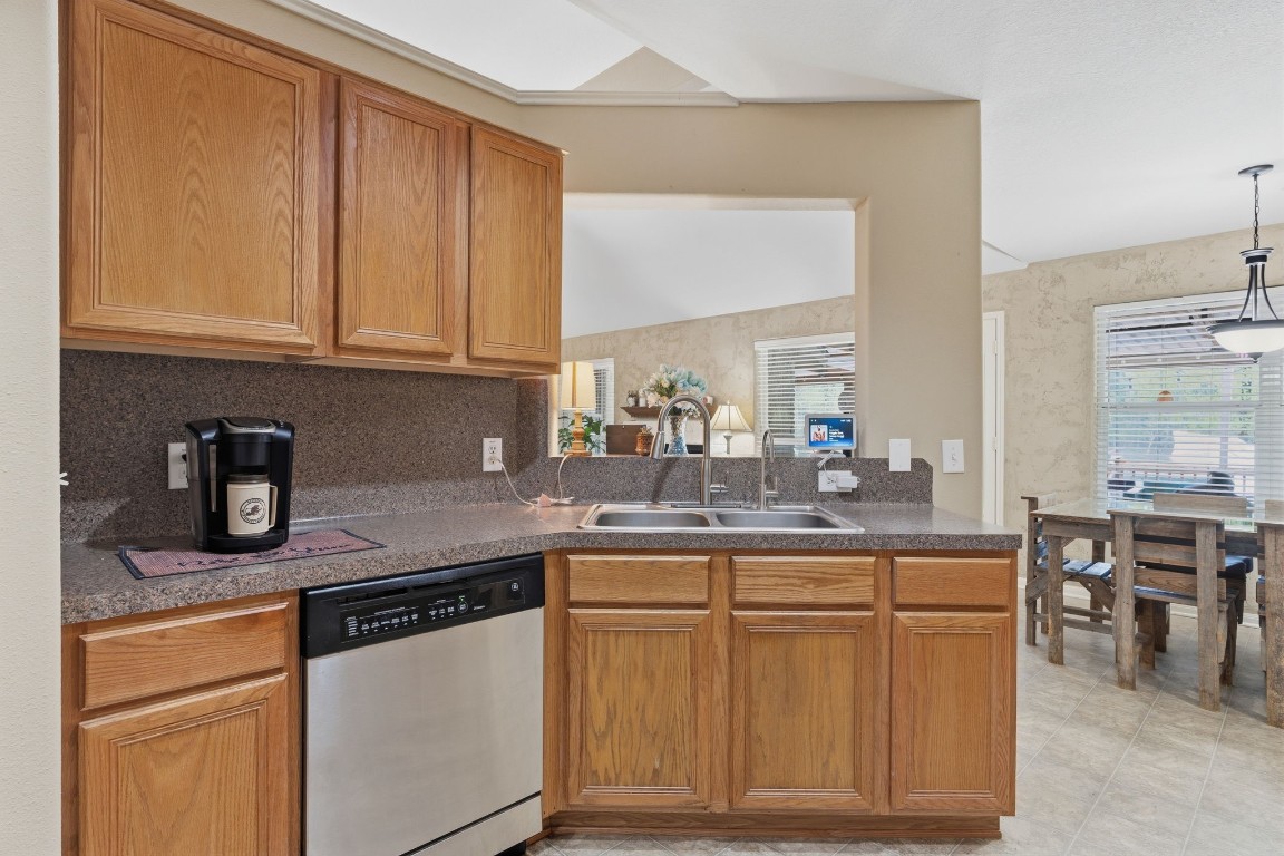 907 Columbia River Road Montgomery, TX 77316 - Photo 9 of 34 a kitchen with stainless steel appliances granite countertop a sink stove and cabinets
