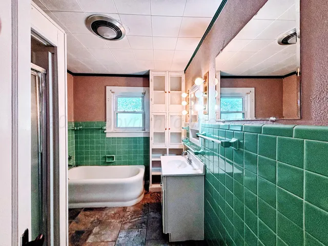 a view of a bathroom with a sink and a window