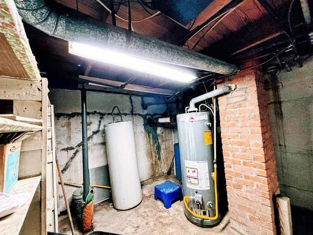a bathroom with a bathtub sink and mirror