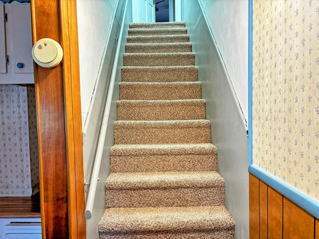 a view of a livingroom with a staircase