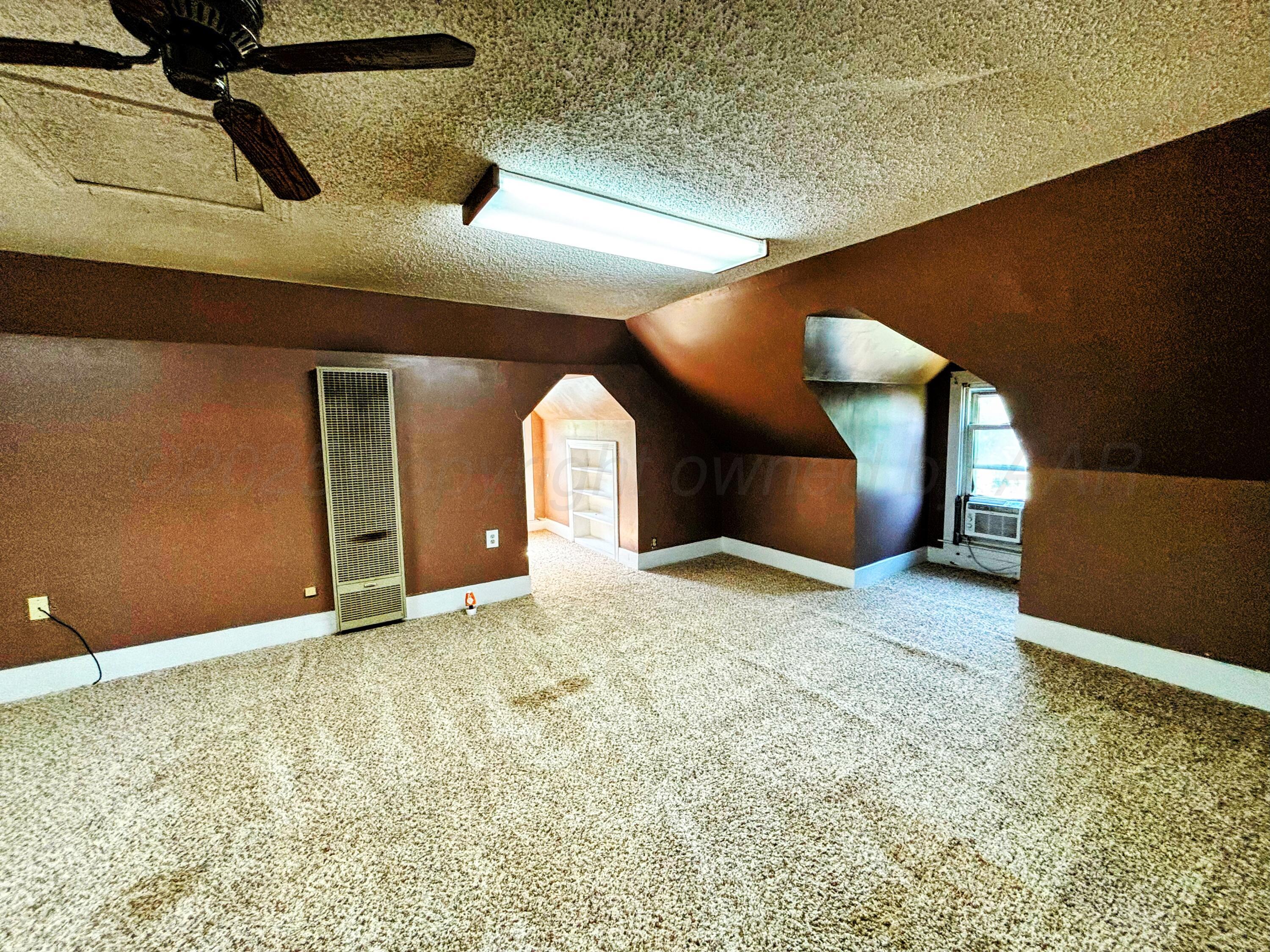 522 South Baylor Street Perryton, TX 79070 - Photo 28 of 52 a view of a livingroom with a staircase