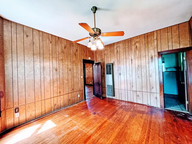 a view of a room with a ceiling fan