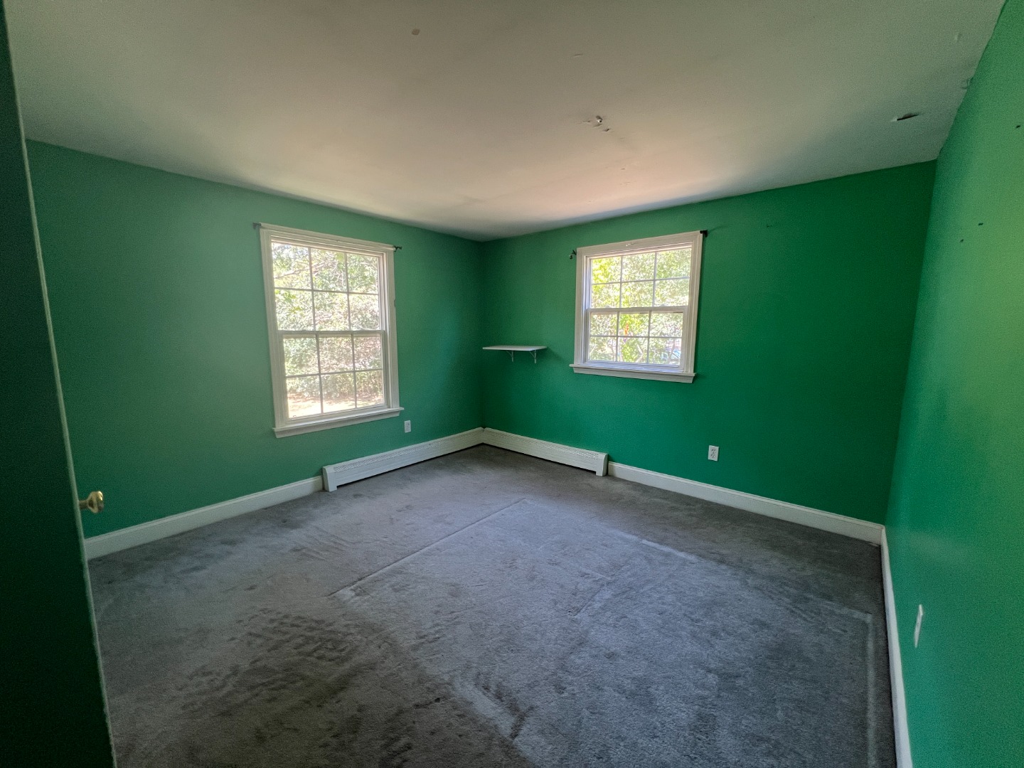67 12th Street Edgartown, MA 02539 - Photo 11 of 23 a view of an empty room with a window and closet area