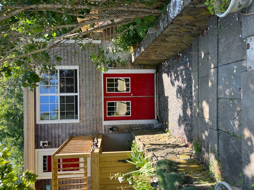 67 12th Street Edgartown, MA 02539 - Photo 18 of 23 a front view of a house with a yard