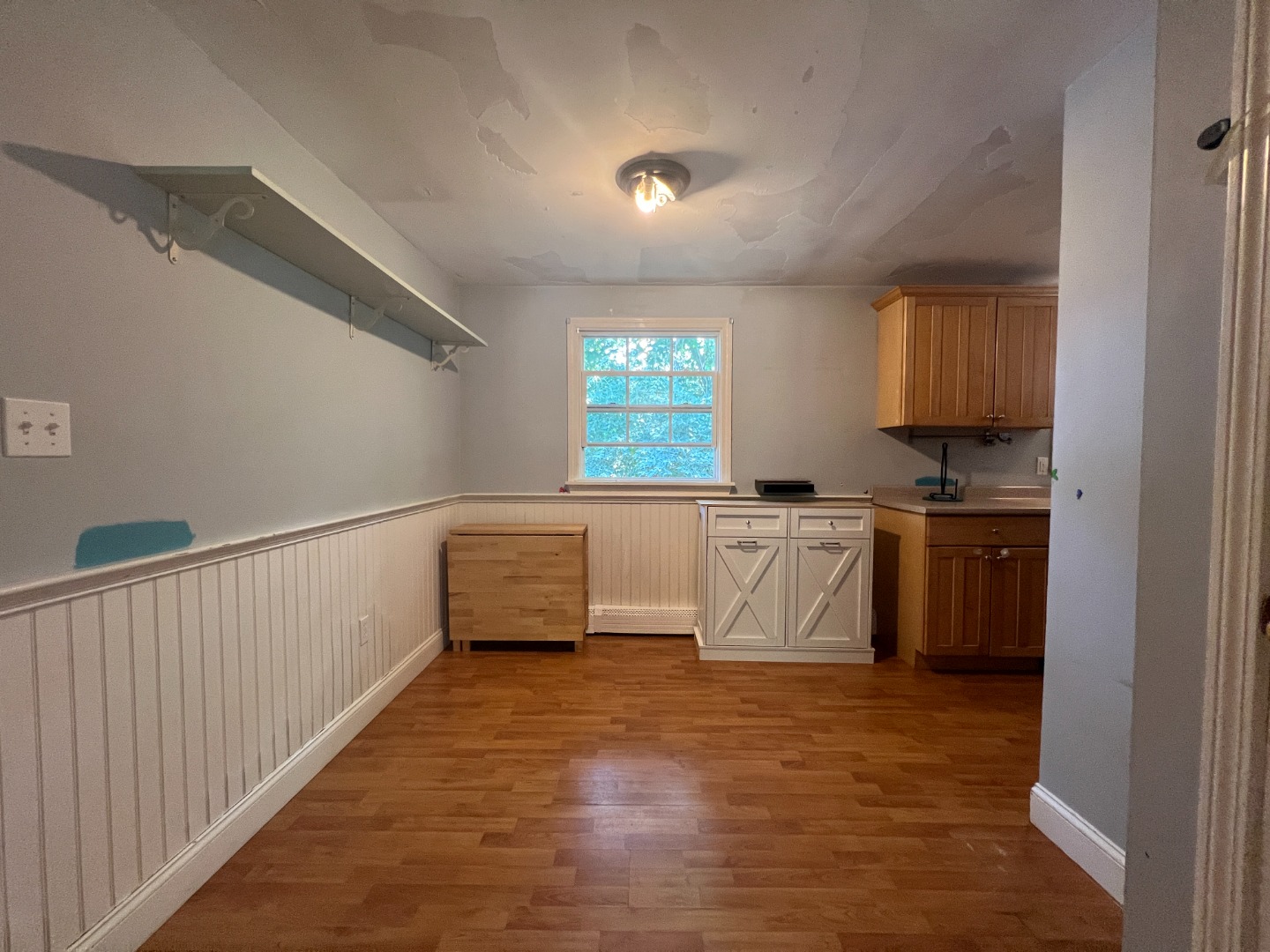 67 12th Street Edgartown, MA 02539 - Photo 6 of 23 a kitchen with granite countertop a sink and a stove top oven