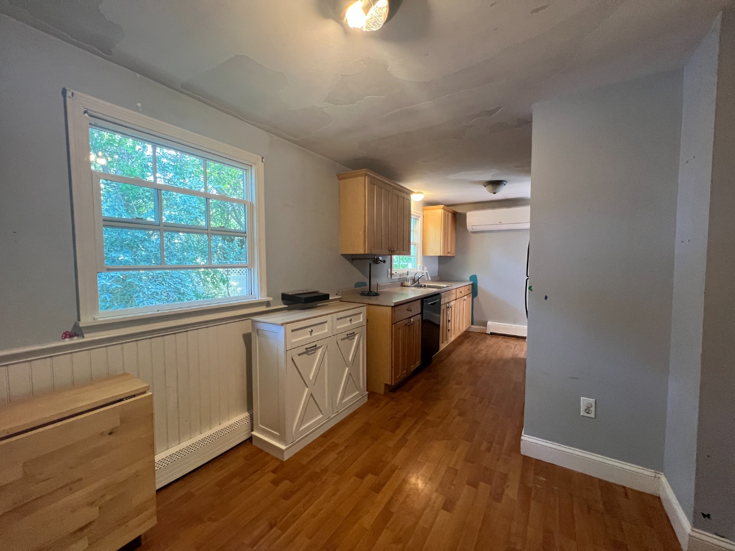 67 12th Street Edgartown, MA 02539 - Photo 7 of 23 a kitchen with granite countertop white cabinets and white appliances