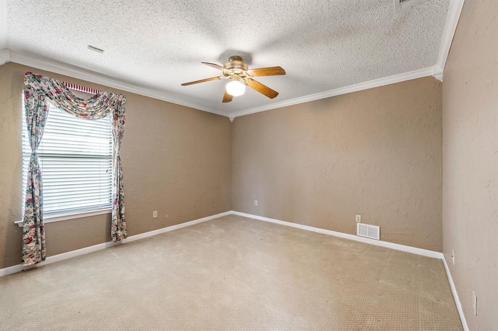 7260 Hudson Cemetery Road Mansfield, TX 76063 - Photo 25 of 40 Room featuring a window with horizontal blinds, a ceiling fan with light fixture, crown molding, baseboards, and carpet flooring