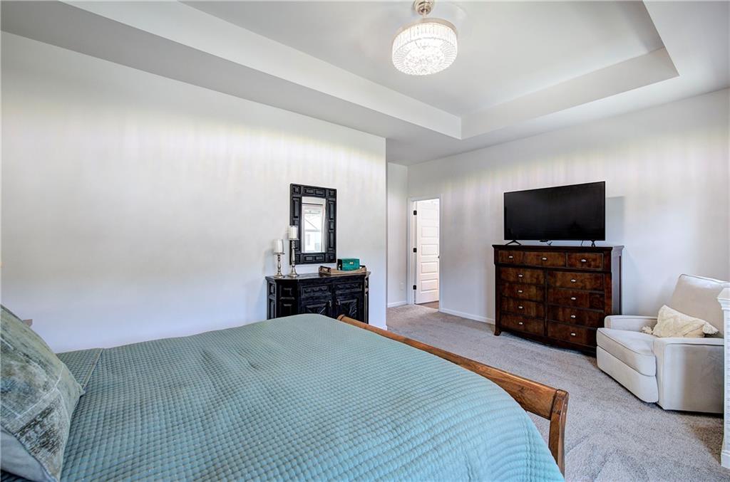 402 Perth Drive Cartersville, GA 30121 - Photo 18 of 31 a bedroom with a bed and a flat screen tv