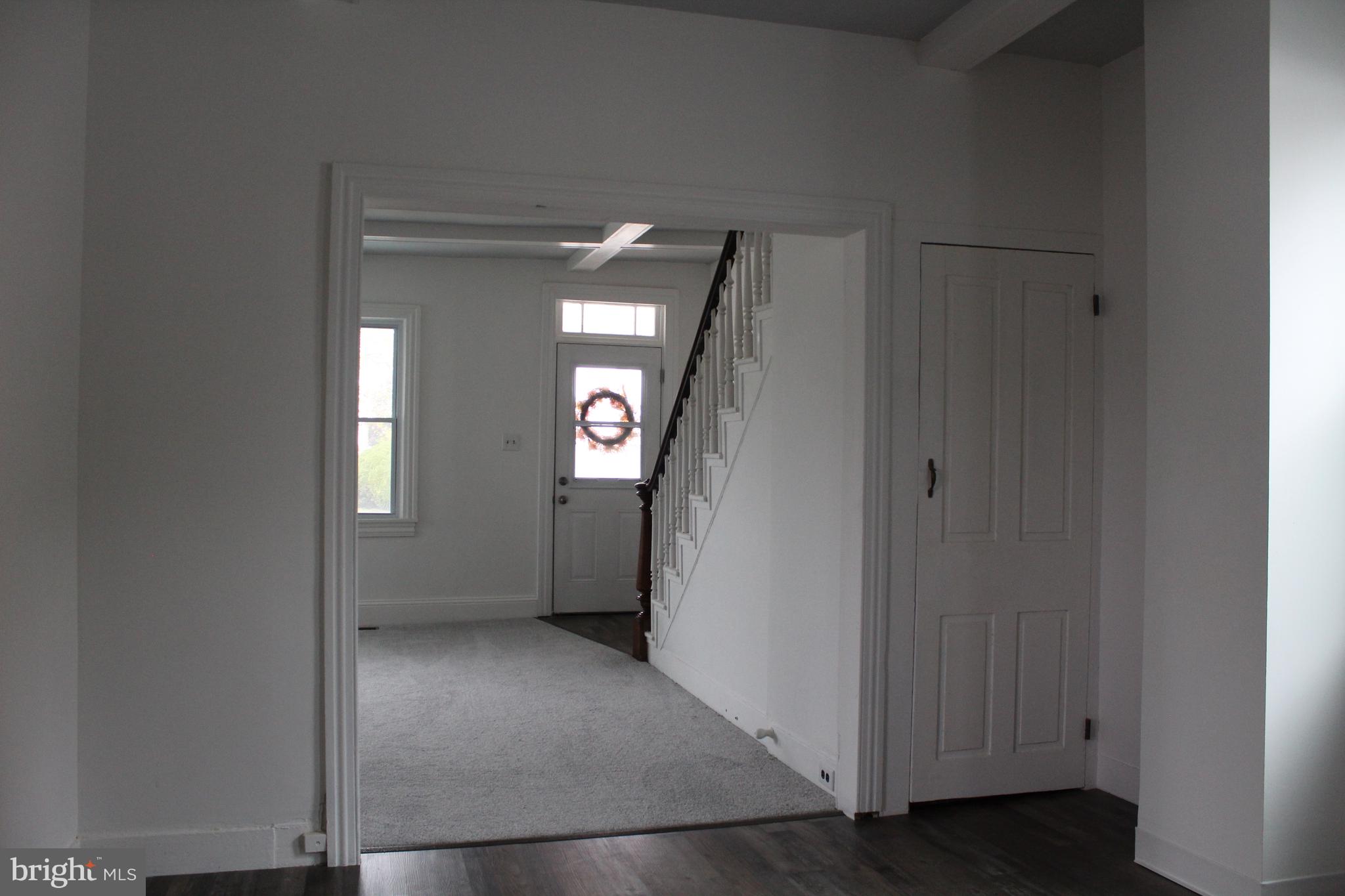 150 Main Street Dover, DE 19901 - Photo 11 of 50 an empty room with windows and mirror