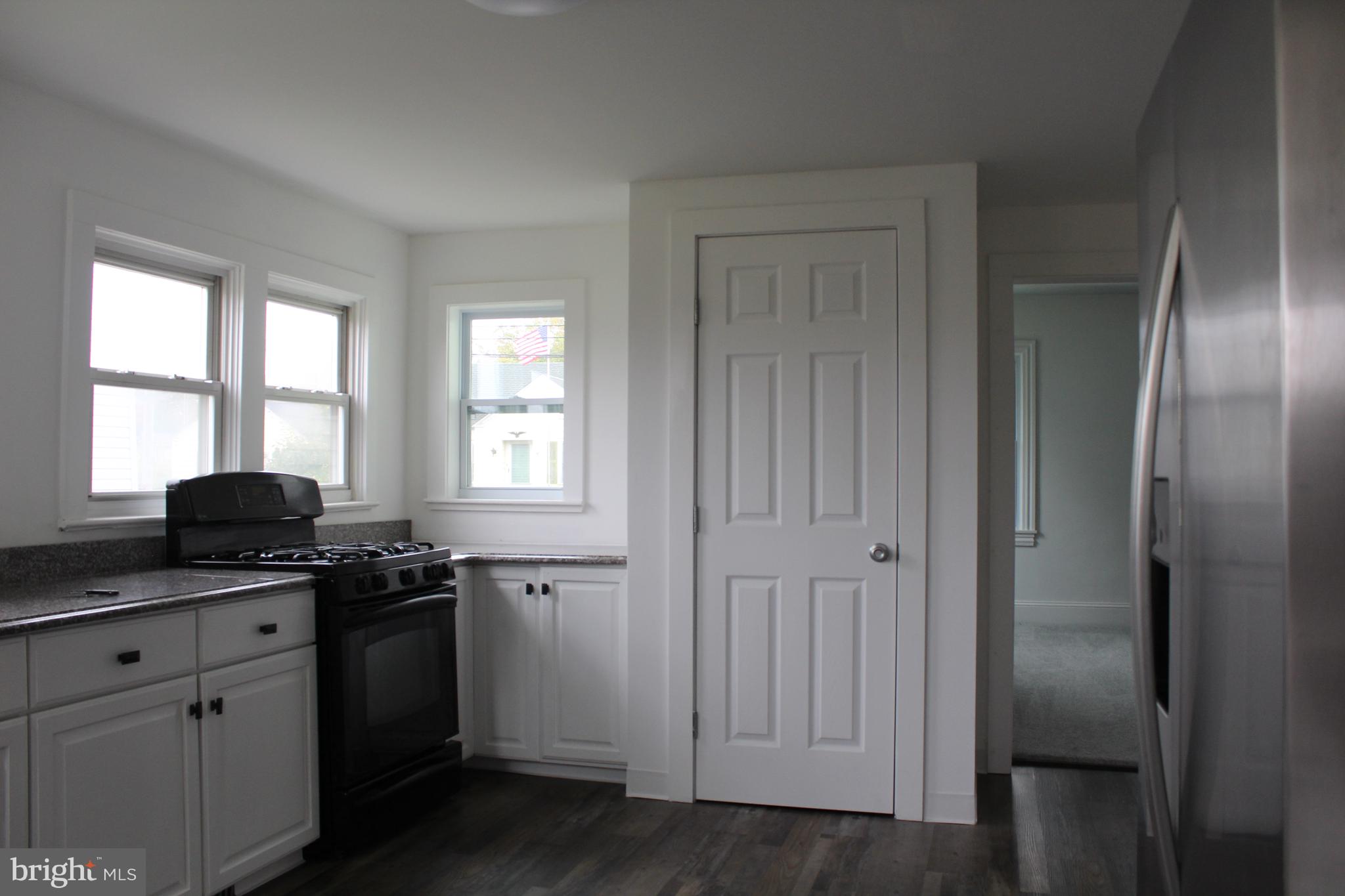 150 Main Street Dover, DE 19901 - Photo 14 of 50 a kitchen with a sink appliances and cabinets
