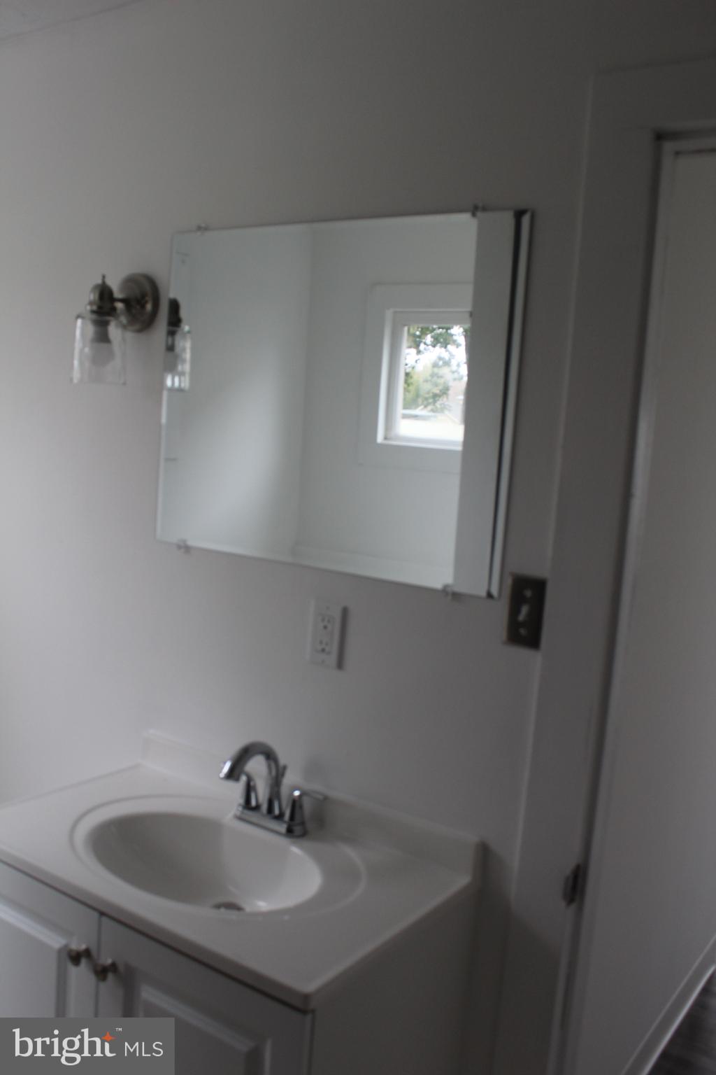 150 Main Street Dover, DE 19901 - Photo 25 of 50 a bathroom with a sink and a toilet