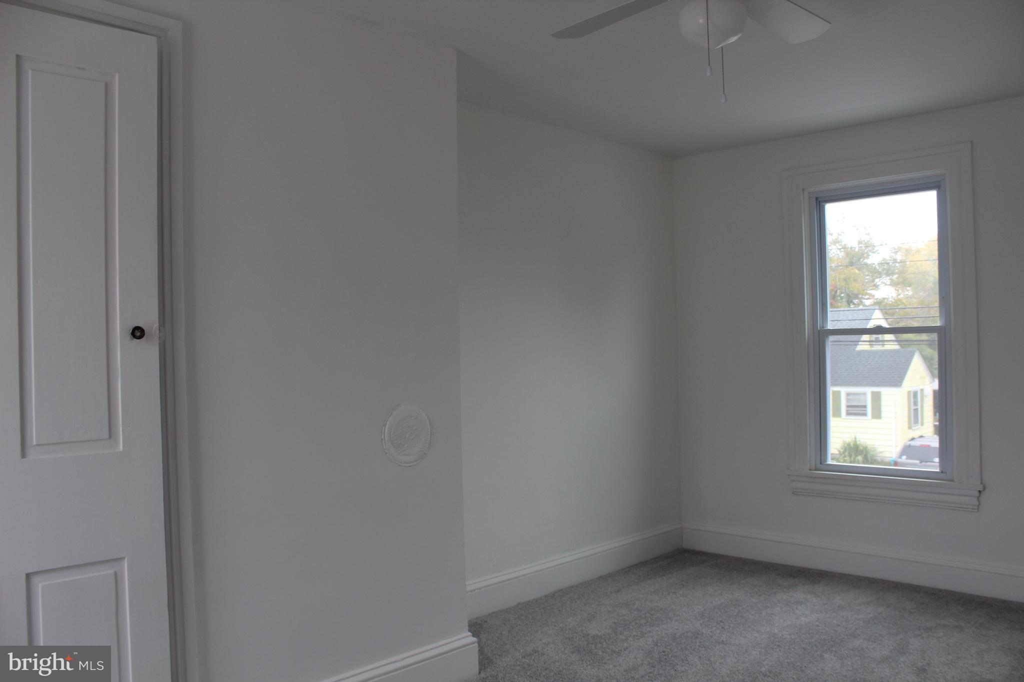 150 Main Street Dover, DE 19901 - Photo 32 of 50 an empty room with a window