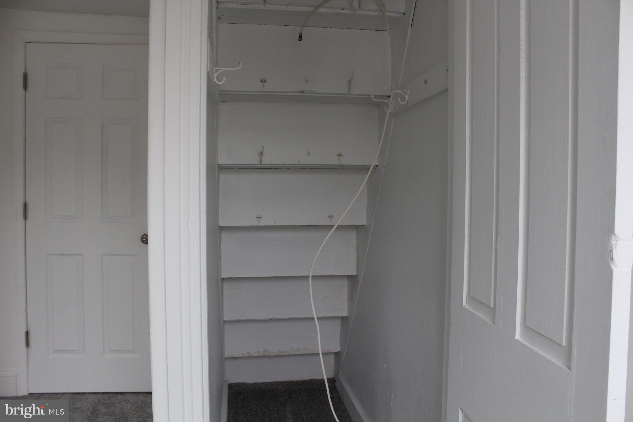 150 Main Street Dover, DE 19901 - Photo 39 of 50 a view of walk in closet with empty racks