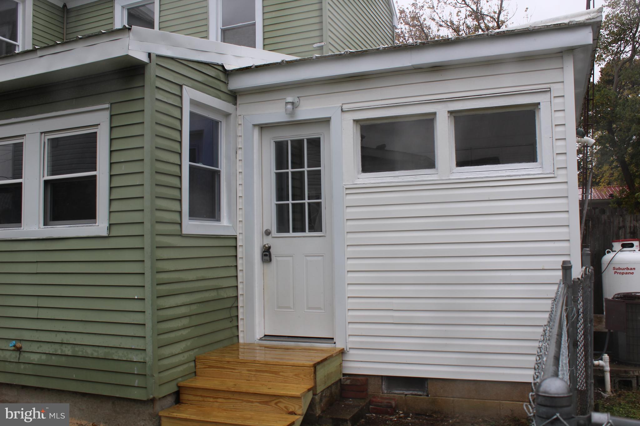 150 Main Street Dover, DE 19901 - Photo 48 of 50 a view of a house with a door and a tree