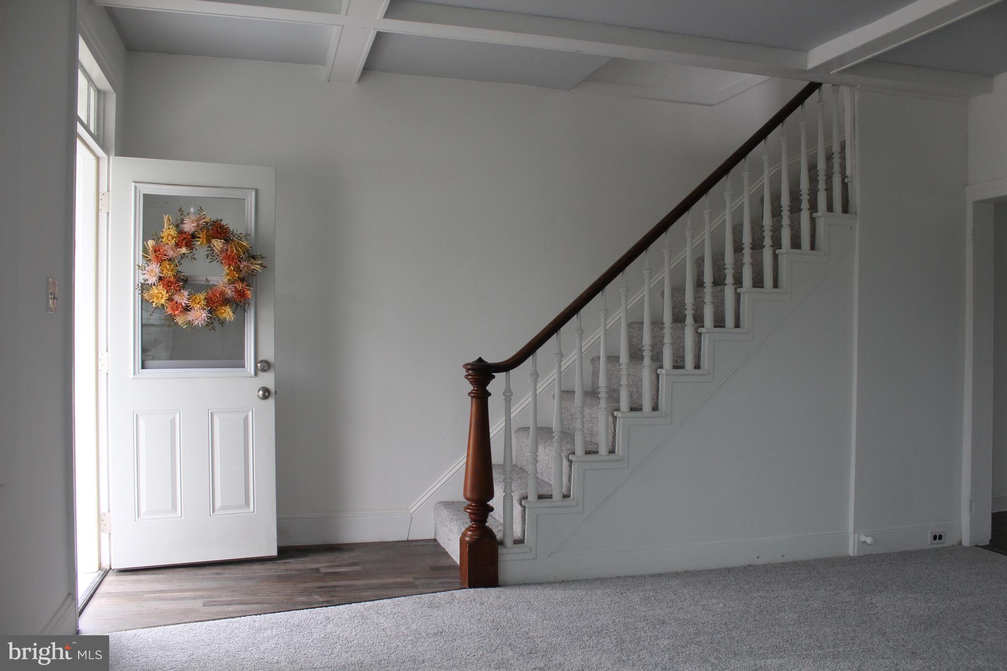 150 Main Street Dover, DE 19901 - Photo 7 of 50 a view of entryway with stairs and wooden floor