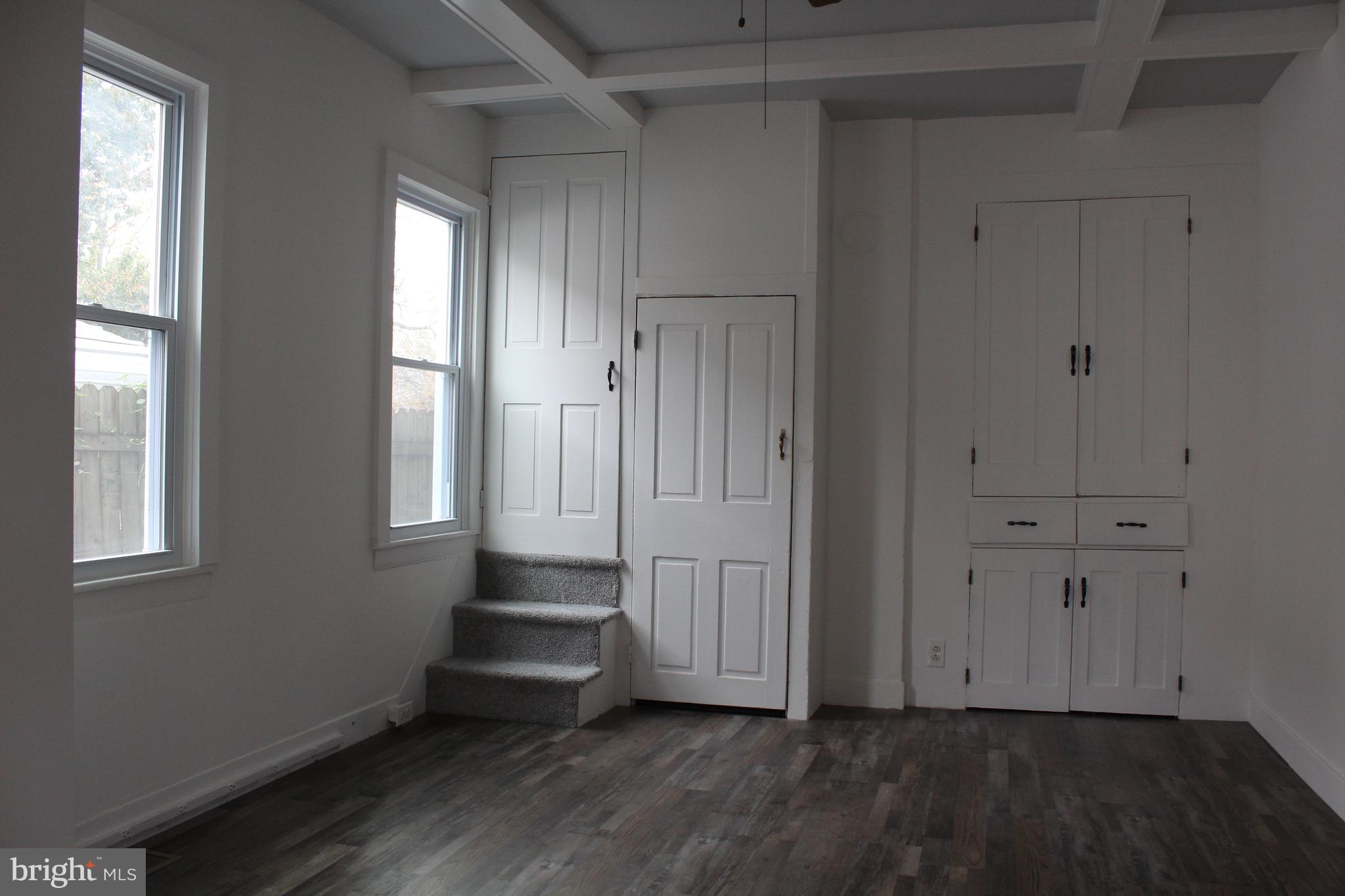 150 Main Street Dover, DE 19901 - Photo 9 of 50 a view of an empty room with wooden floor and a window