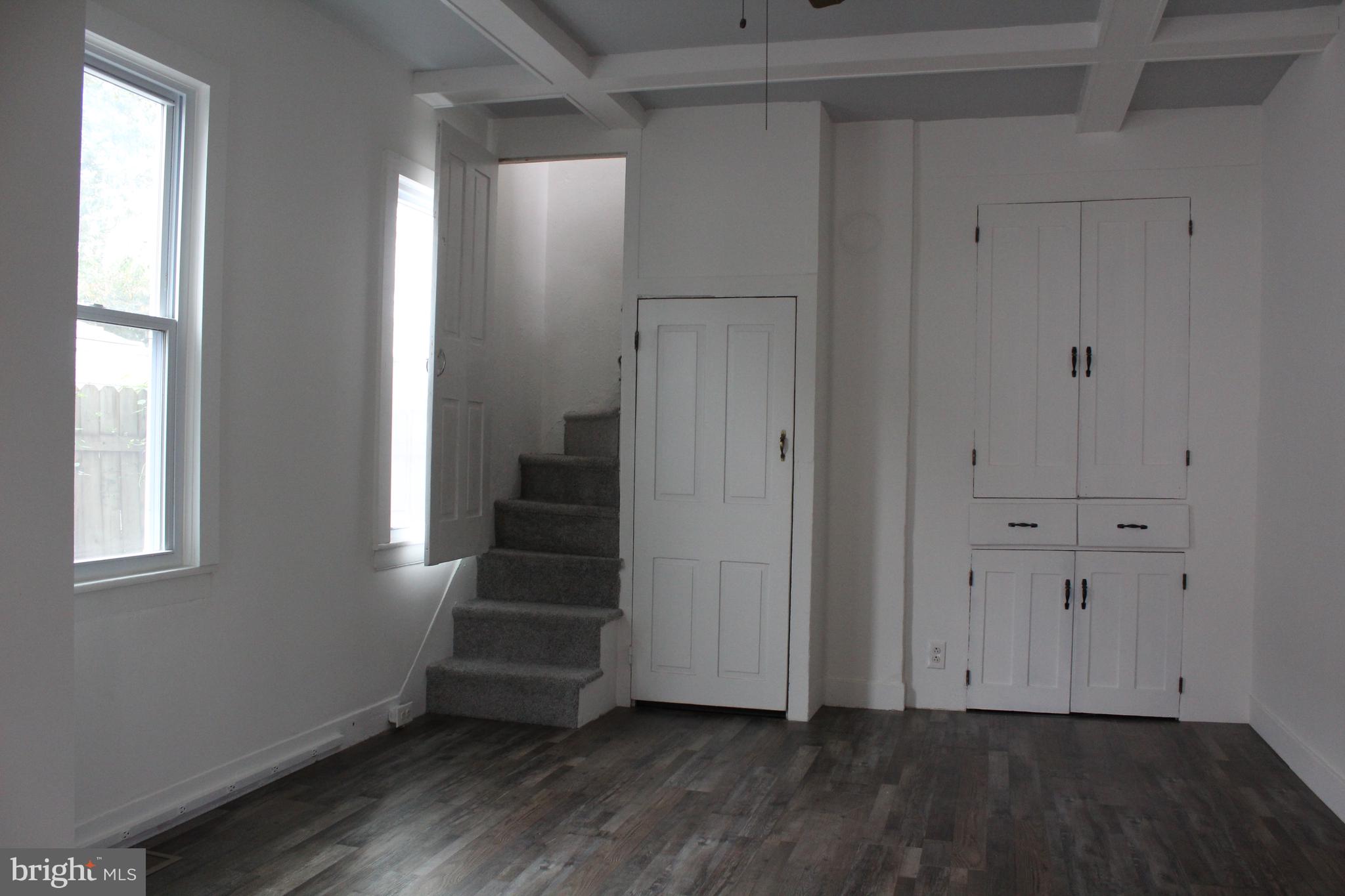 150 Main Street Dover, DE 19901 - Photo 10 of 50 a view of an empty room with wooden floor and stairs