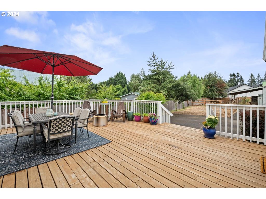 17762 South Redland Road Oregon City, OR 97045 - Photo 2 of 37 a view of balcony with outdoor seating and wooden floor