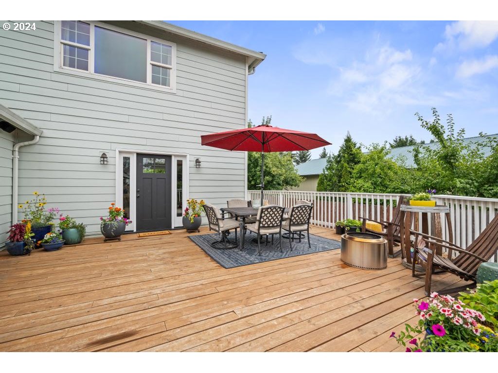 17762 South Redland Road Oregon City, OR 97045 - Photo 3 of 37 a view of a chairs and table on the wooden deck