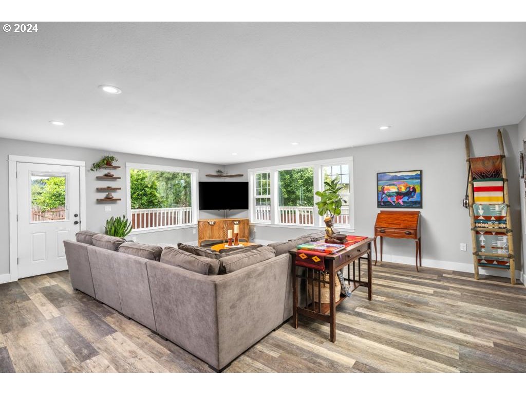 17762 South Redland Road Oregon City, OR 97045 - Photo 5 of 37 a living room with furniture and a flat screen tv