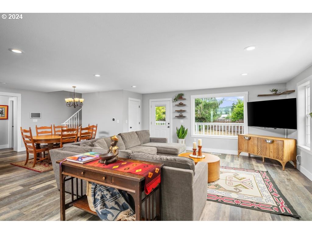 17762 South Redland Road Oregon City, OR 97045 - Photo 7 of 37 a living room with furniture and a flat screen tv